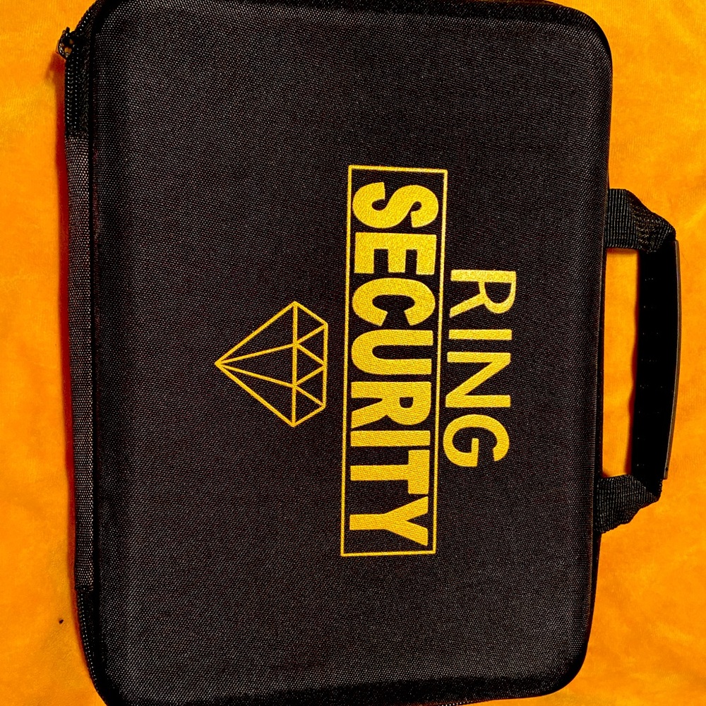 Ring security case with book for ring bearer.